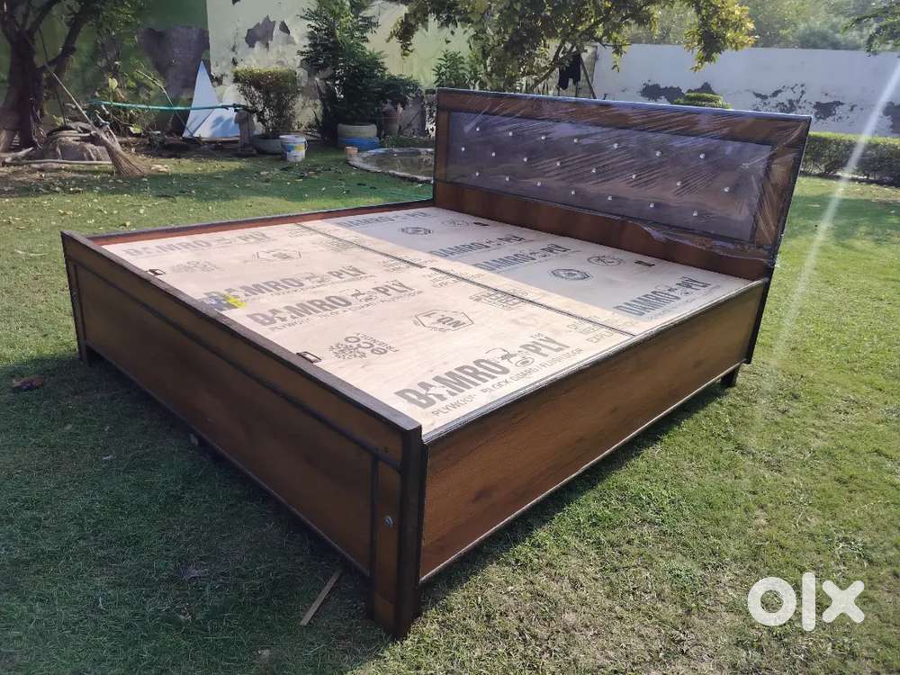 Unused new wooden double bed with box available