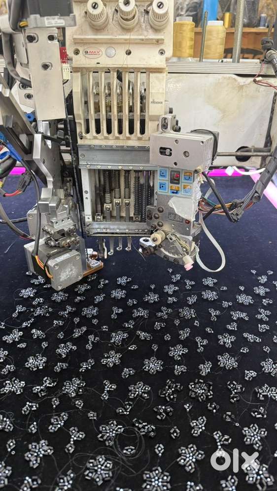 Computer embroidery machine with twin beads and cording