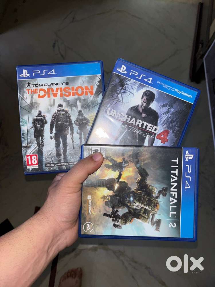 PlayStation CD of Uncharted 4, The Division and Titan Fall 2