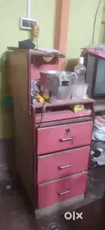 Multiple furnitures including rack, table with drawers showcase