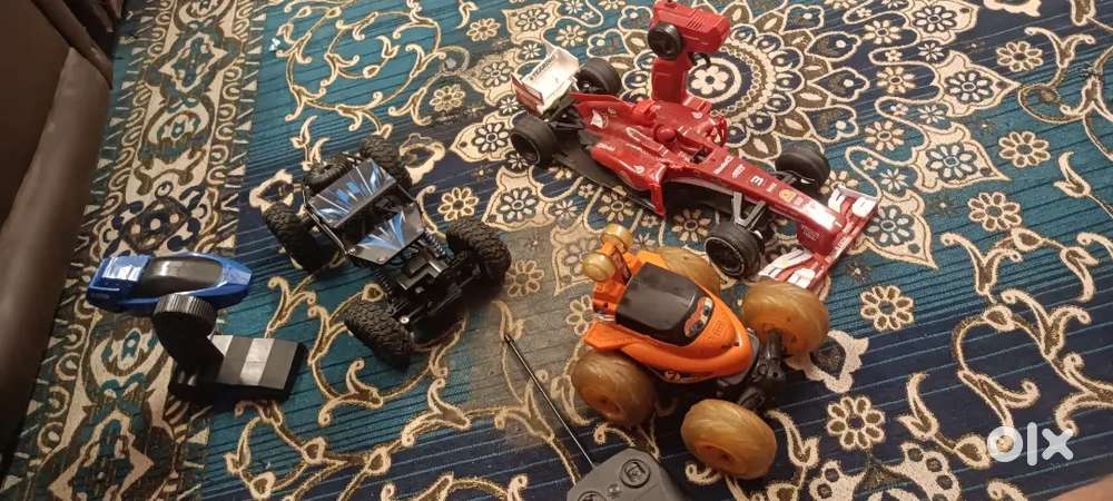 3 toy unused car's Whit chargers and Remote