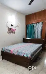 Home Centre Wooden Queen Bed with Spring Mattress