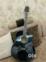 Black colour shiny guitar for you and not used single time