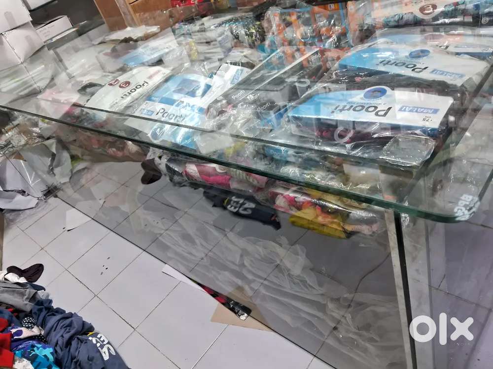 Toughned glass display table size 8 ft x 2.5 ft