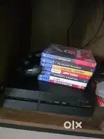 PS4 with controller and games