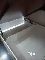 Storage cot with lift up and dressing
