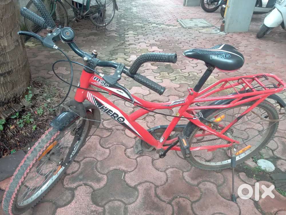 A new red hero cycle with a black old hercules cycle