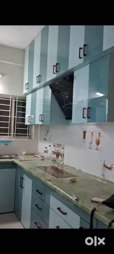 Modular kitchen, made with acrylic and green ply beautiful pooja room
