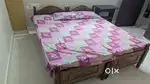 Two single cot beds with mattresses