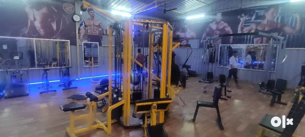 gym full equipment with counter chair and sound system