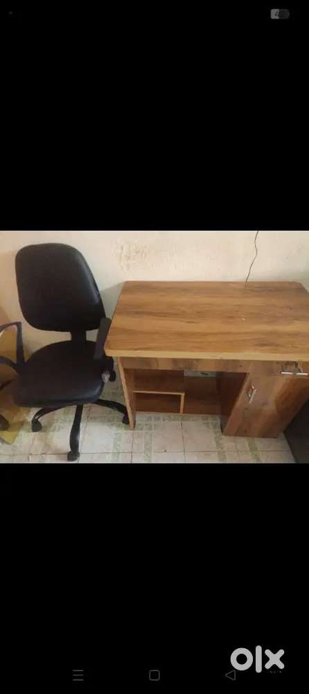 A computer desk and office chairs