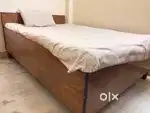 Queen size wooden dewan bed with a box