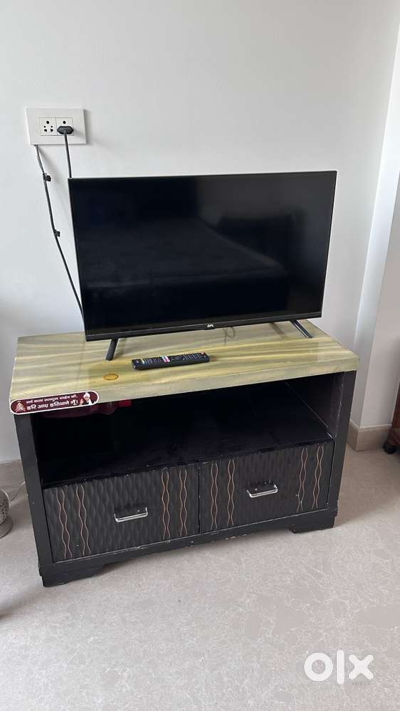 Smart TV with Remote and Wooden drawer Cabinet