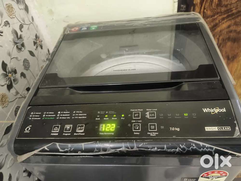 Whirlpool matic 7 kg top load washing machine with stand.