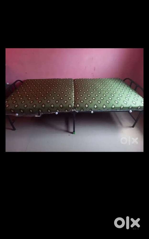 Cot with bed attached