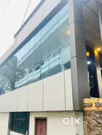 “70 Cent NH Roadside Plot with House & 2-Floor Building, Kattappana”