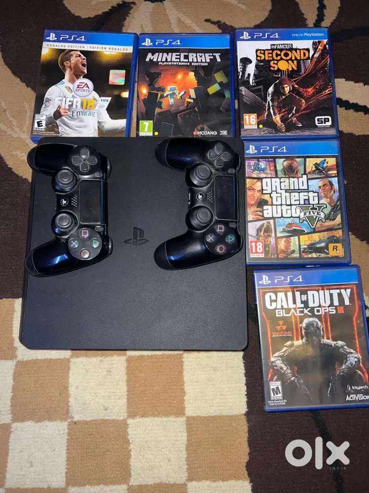 PS4 1TB Slim (Jett Black) With 5 CDs and 3 controllers
