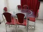 Glass top steel Dining table 6 seater with chairs