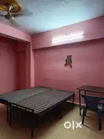 Bed, fan, seperate kitchen and bathroom