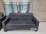 Black leather sofa 2 years old