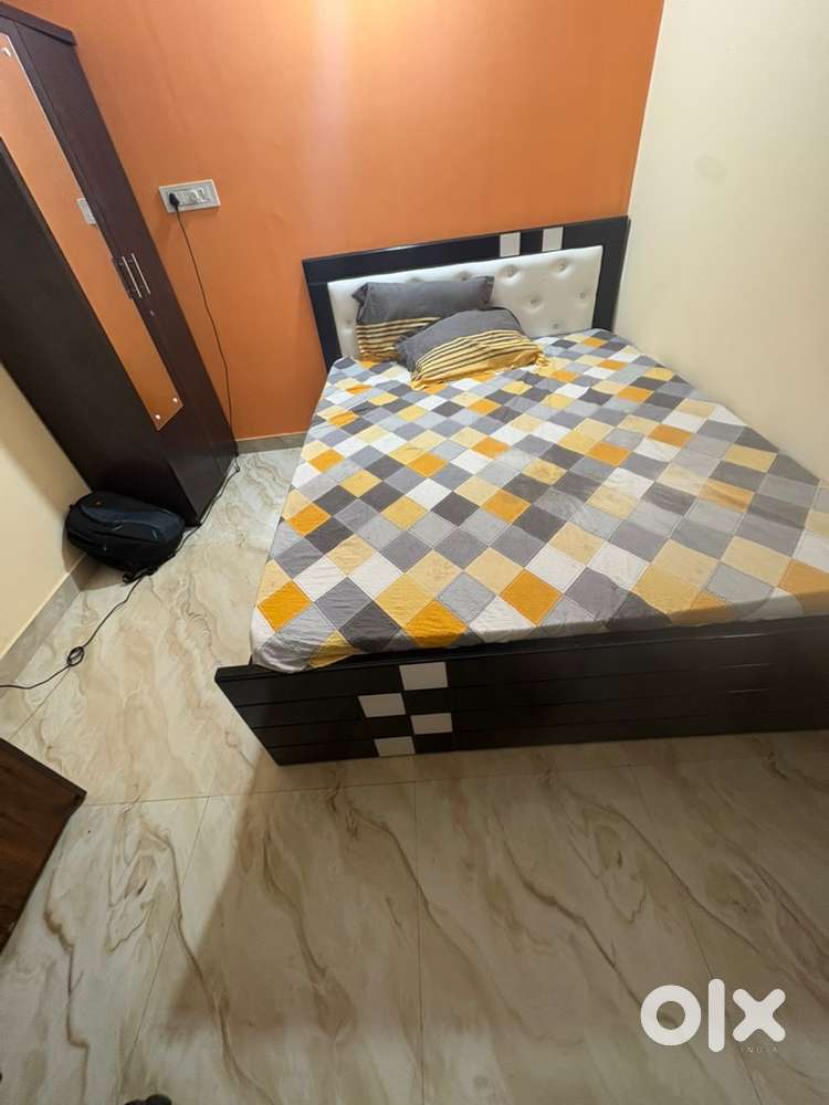 Queen size bed and computer table and revolving chair