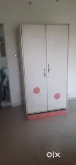single wooden wardrobe and one double bed