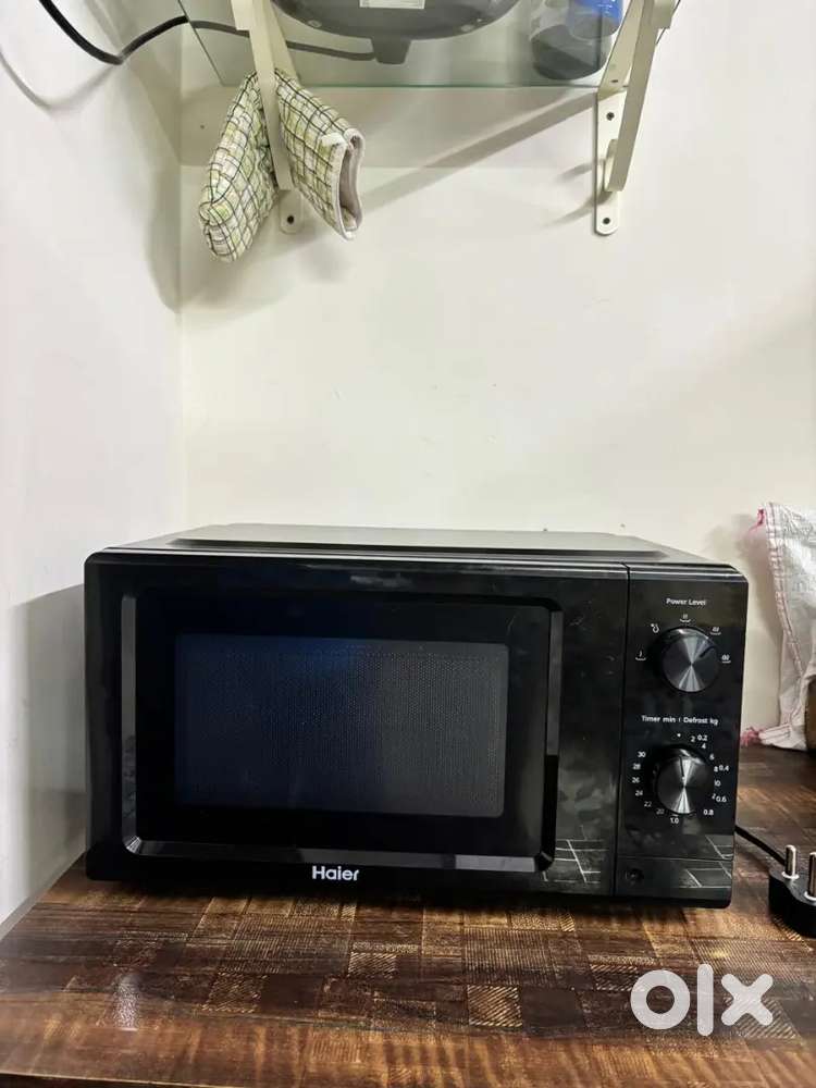 New haier 2 months old microwave with 1 year warranty with box