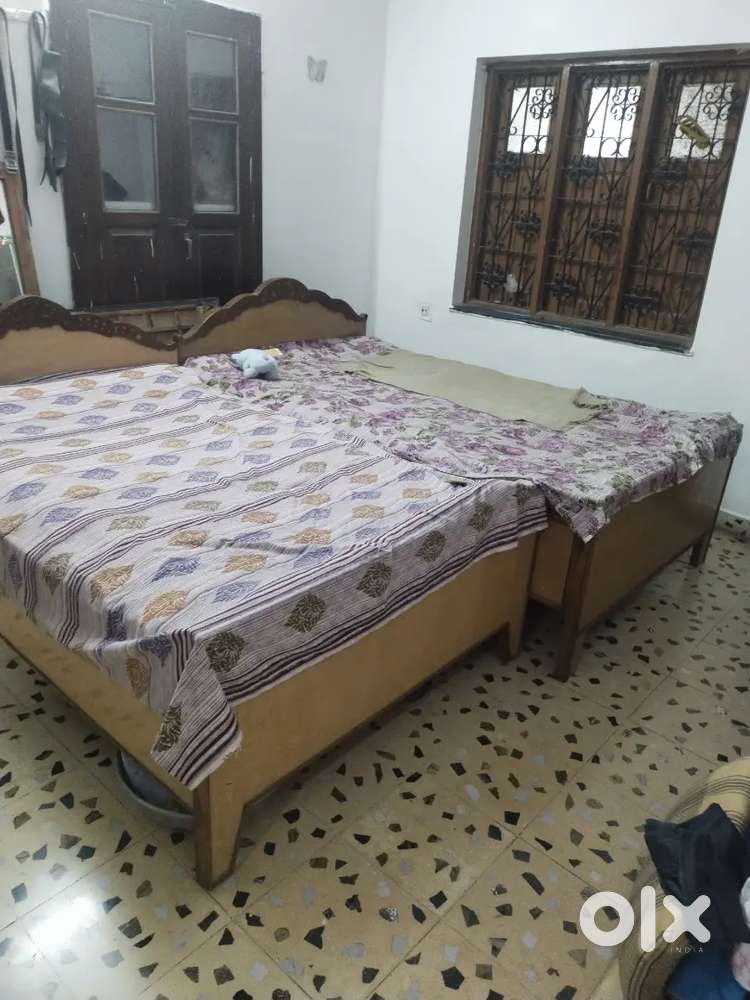 2 wooden beds