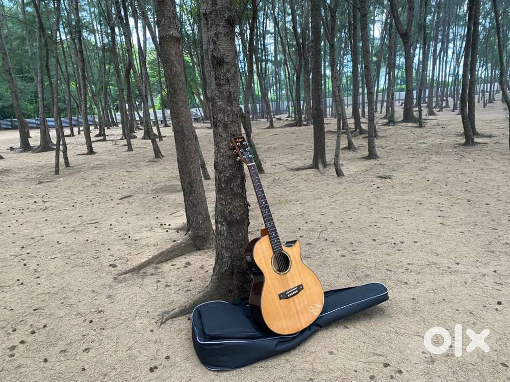 Solid Top Electro Acoustic Guitar