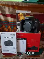 CANON DSLR AND NANO USM IS ZOOM LENSE.