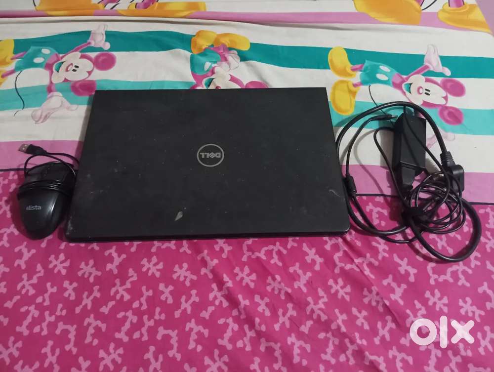 Laptop with charger and mouse