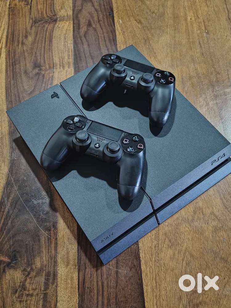 PS4 console with 2 controllers