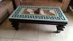 Wooden center table with glass top in excellent condition