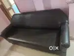 Black Sofa with red mecmal back