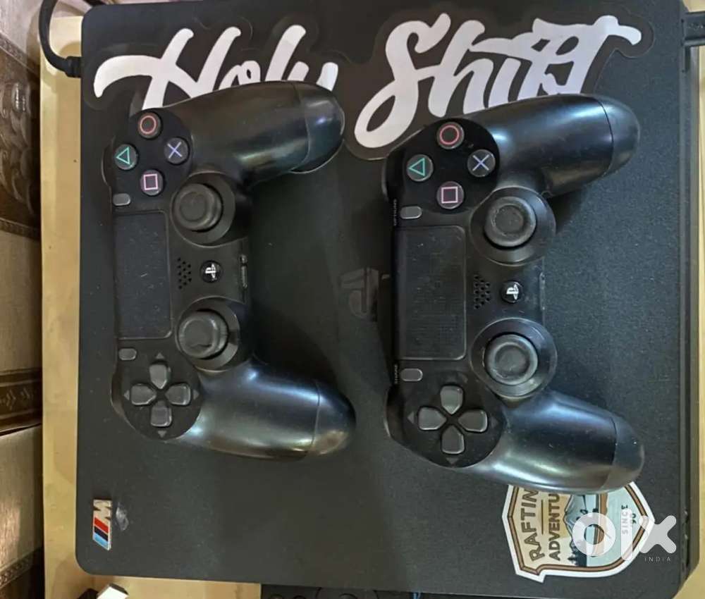 Play station-4 slim 1tb with Box+2 controllers + 11 games titles