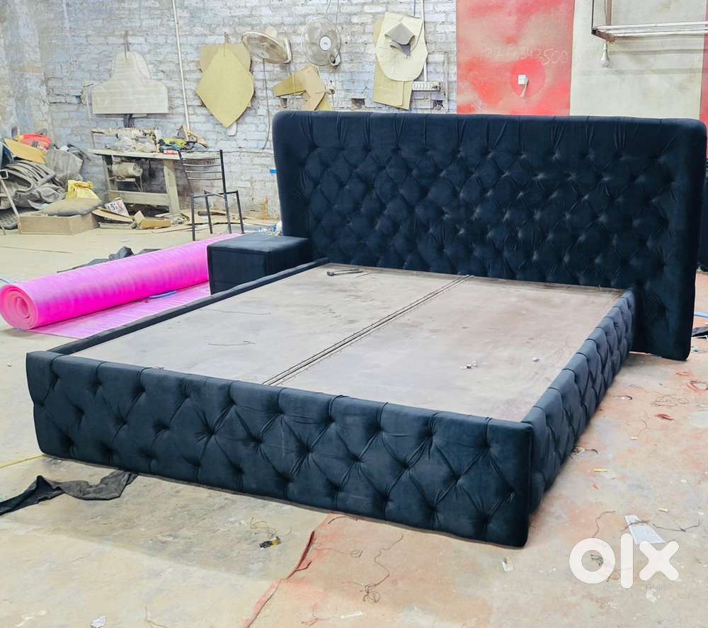 Black king size bed with storage and side table
