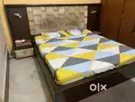 Double bed with side table