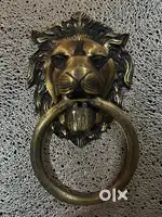 Brass lion antique door knocker