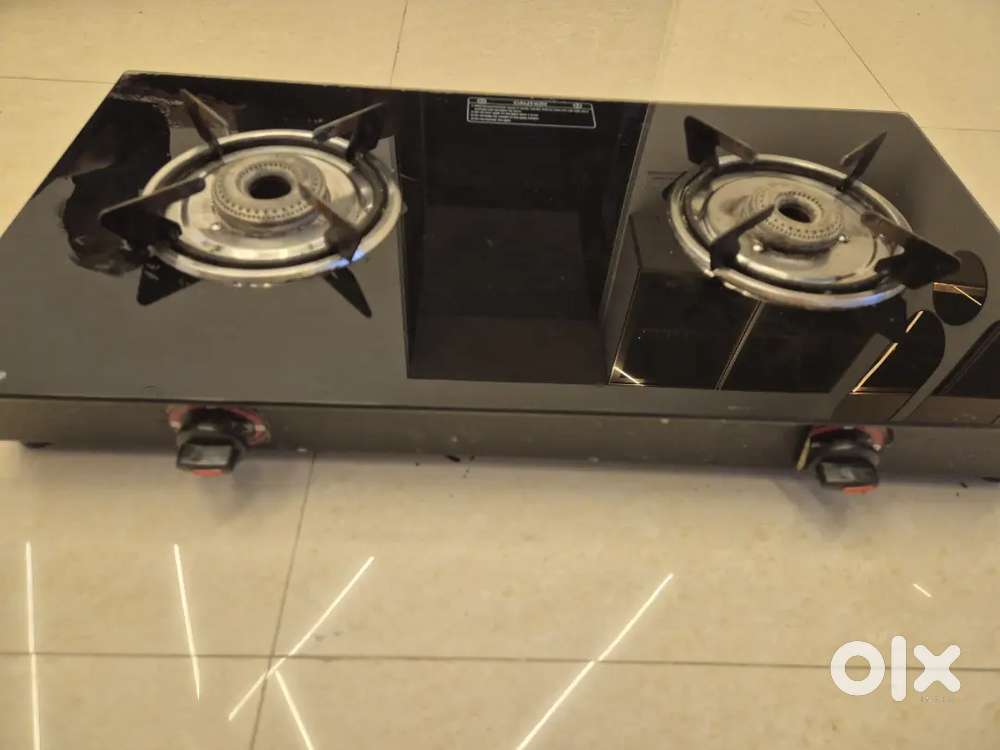Glass top gas stove with regulator