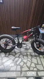 A combat fat tyre cycle imported tourien with 21 speed gears shimano