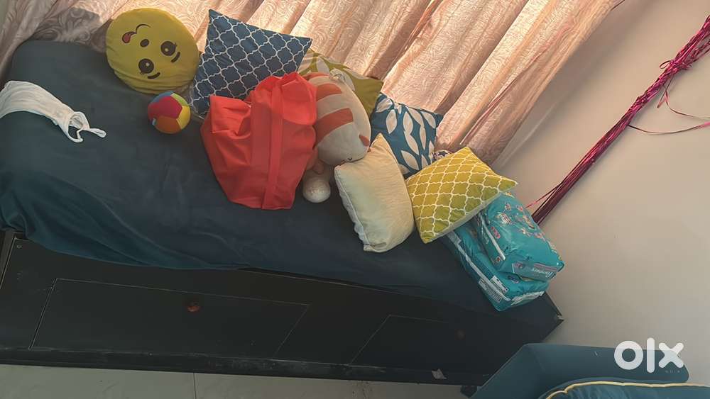 6 seater sofa with a single storage bed and a tea table.