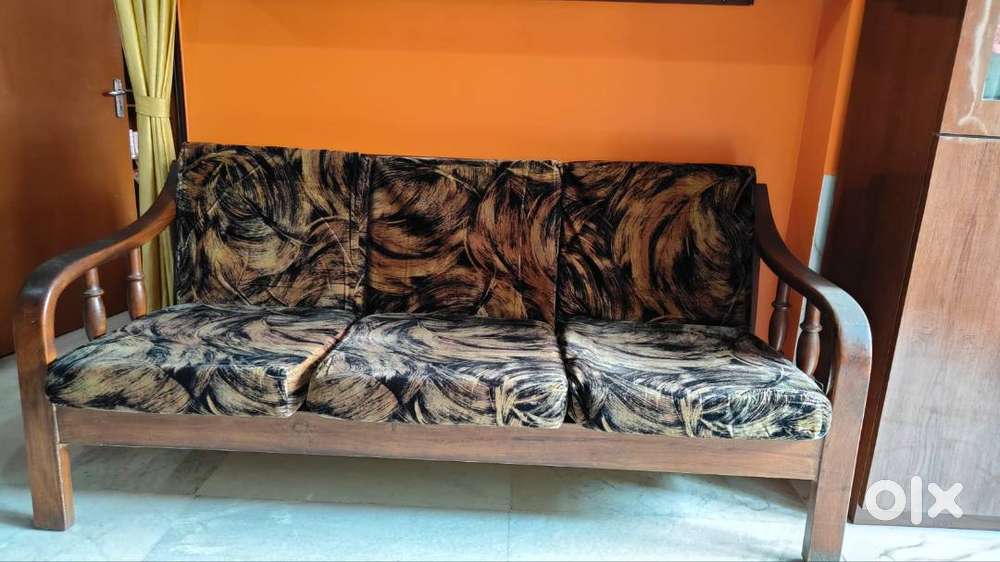 Segun wood 3 seater sofa with velvet covering gaddi