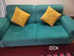 Pure shisham aquamarine colored 03+02 seater sofa with ochre cushion.