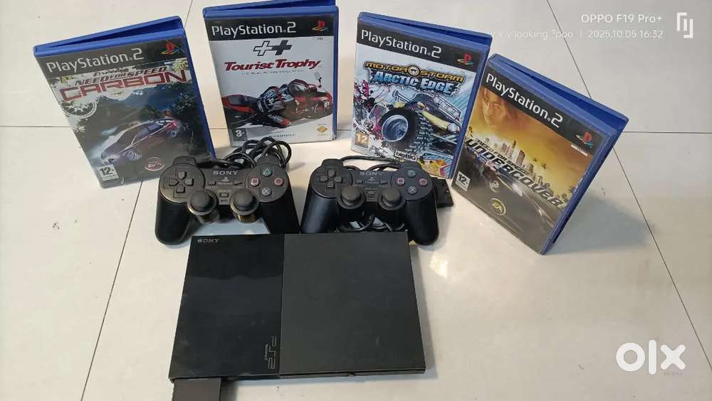 PS2 With 4 Game CD's