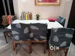 Dining Table with 6 chairs and 1 set of chair covers
