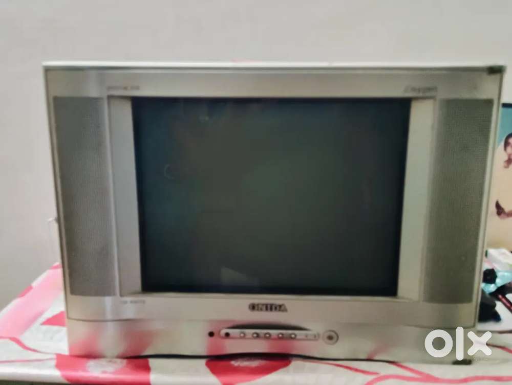 Silver Onida TV with remote