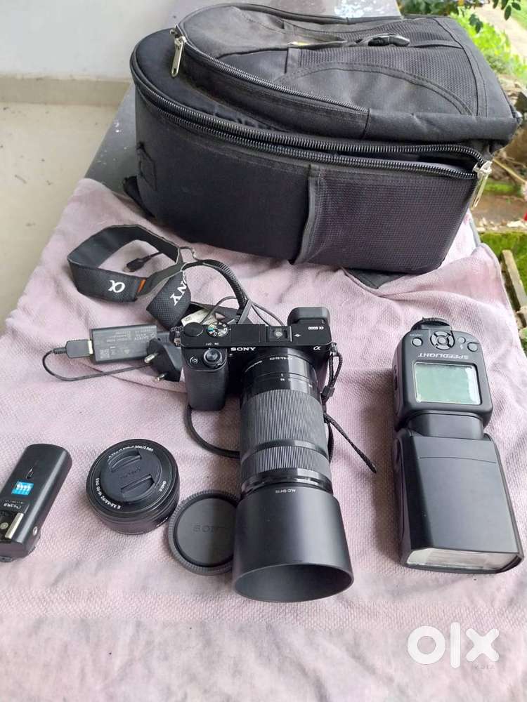 Sony Alpha 6000 with two lenses and flash speedlight