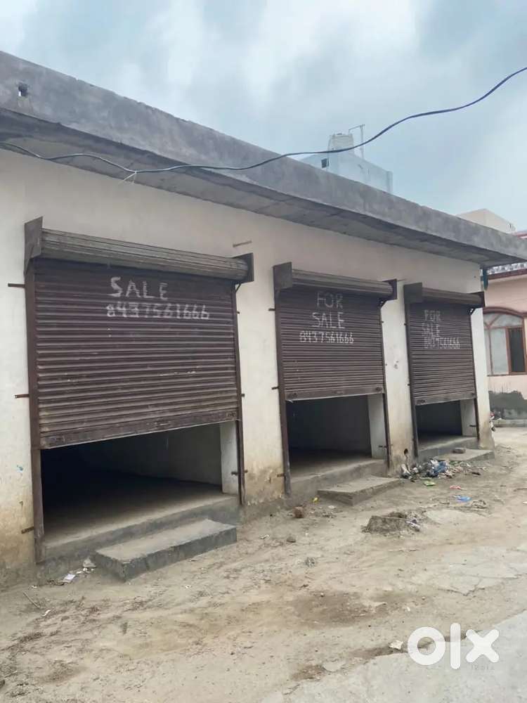 One plot back side of 3 shops in guru nanakpura   in gali no.14 ASR
