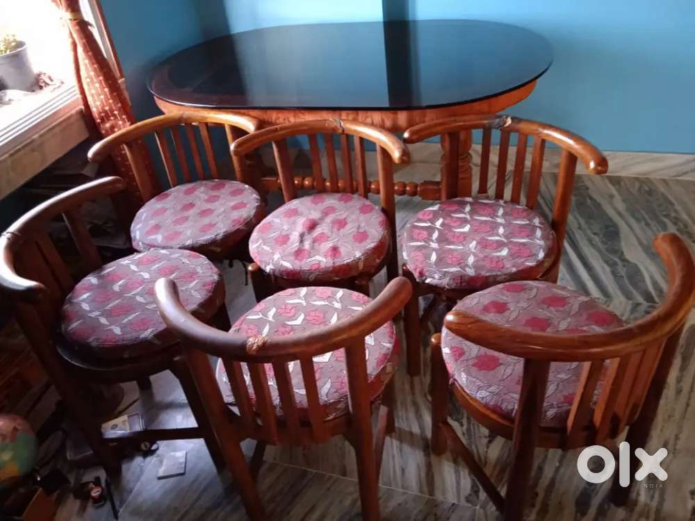 Dining table- sagwan wooden, not a plastic table.