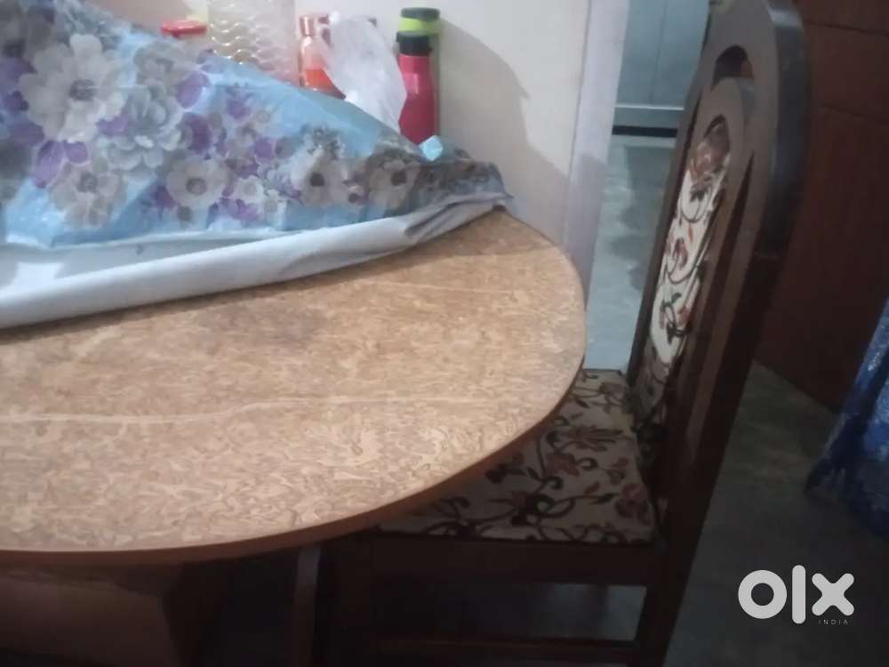 Wooden dining set and steel shocase